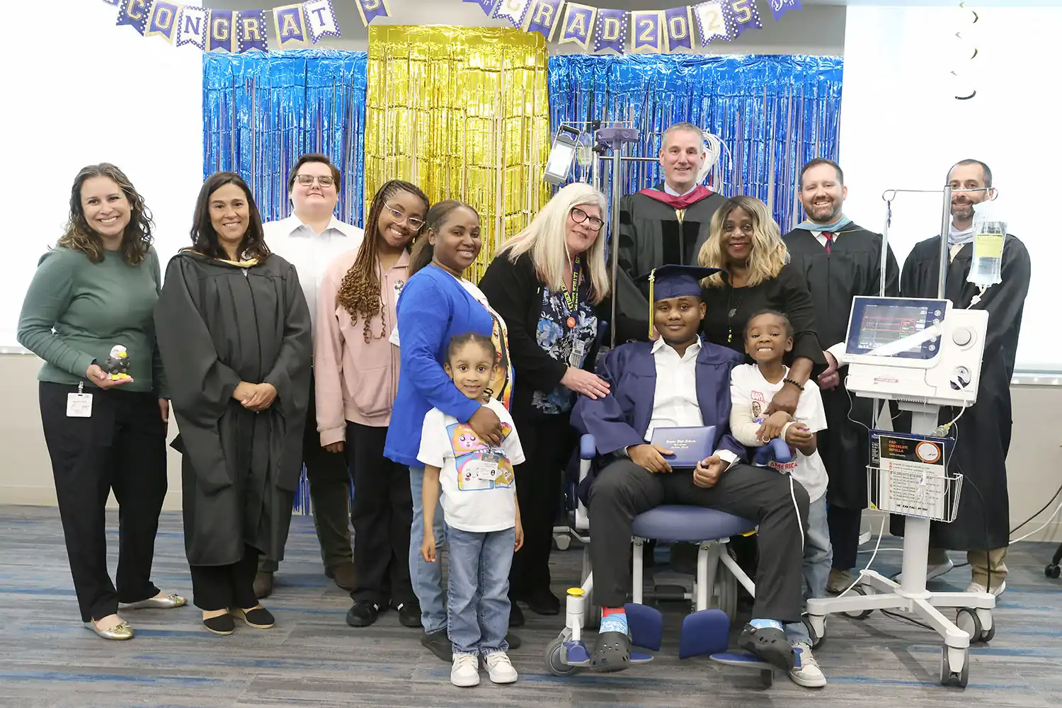 Taevion Norris with guests at his hospital graduation