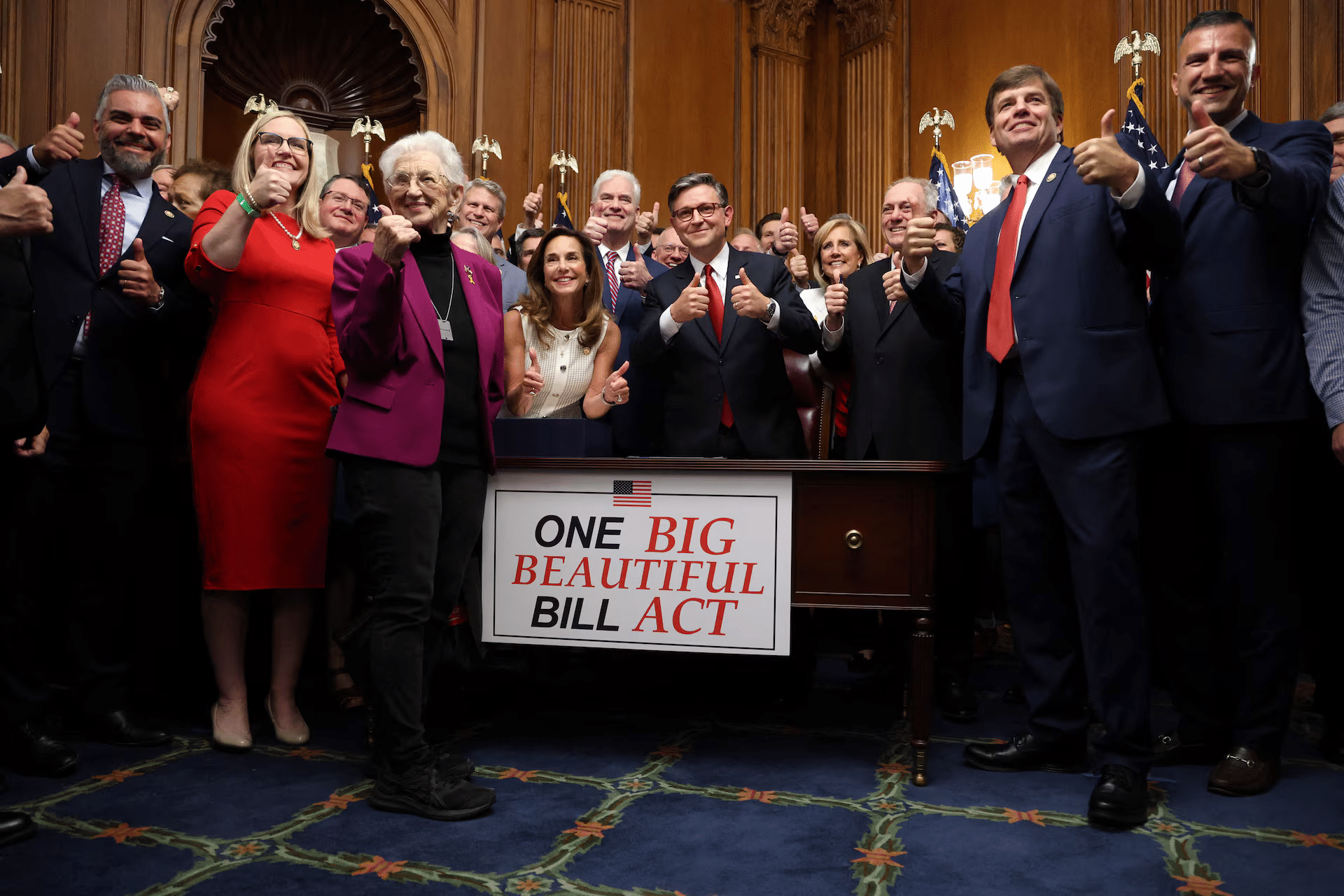 Lawmakers celebrating the signing of major federal legislation